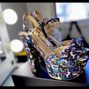 Guess butterfly heels.